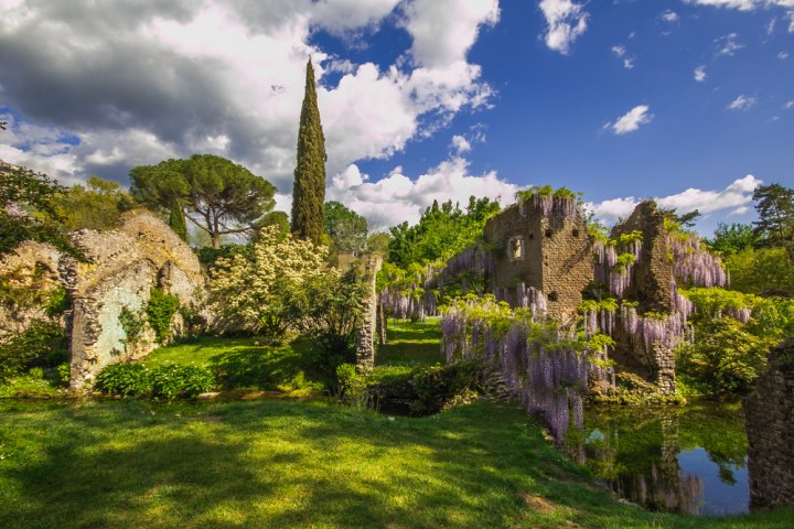 a castle on top of a lush green field
