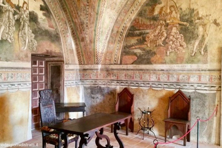 a fire place sitting in a living room filled with furniture and a fireplace