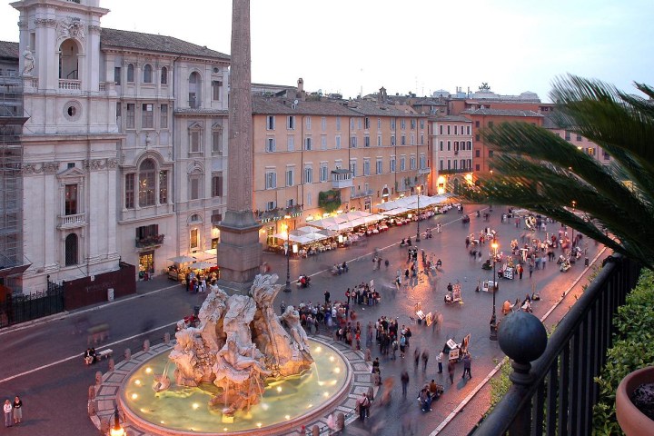 a group of people in front of a building