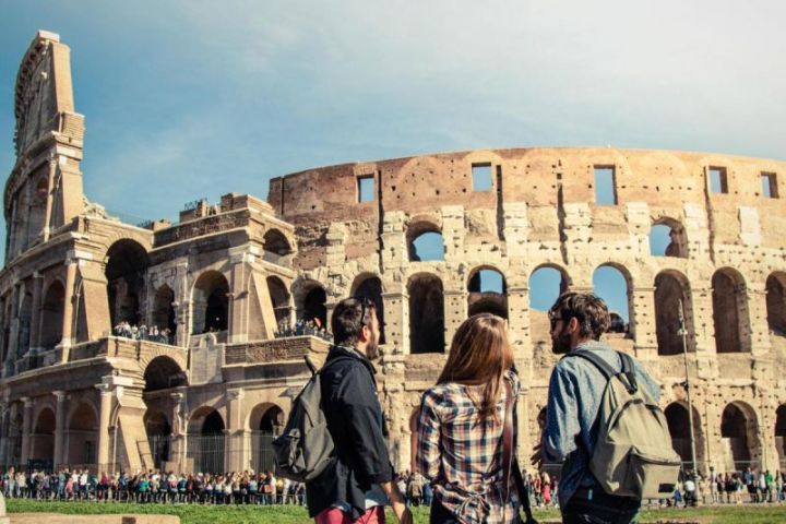 a group of people standing in front of a building