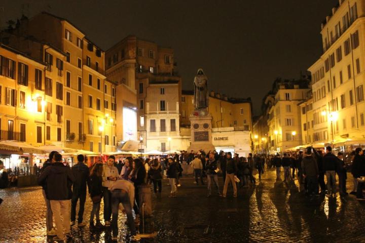 a group of people walking down the street